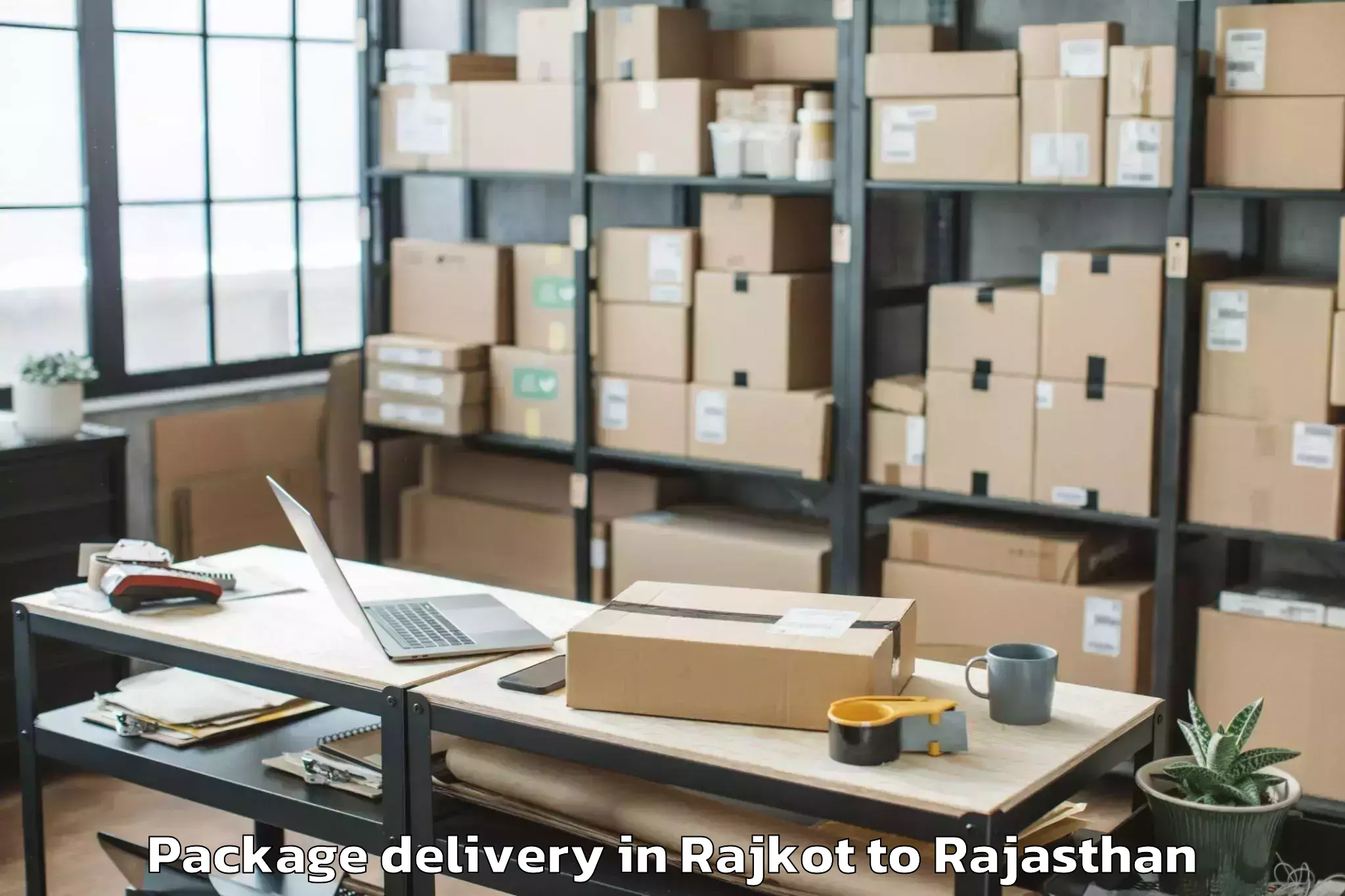 Trusted Rajkot to Ramganj Mandi Package Delivery